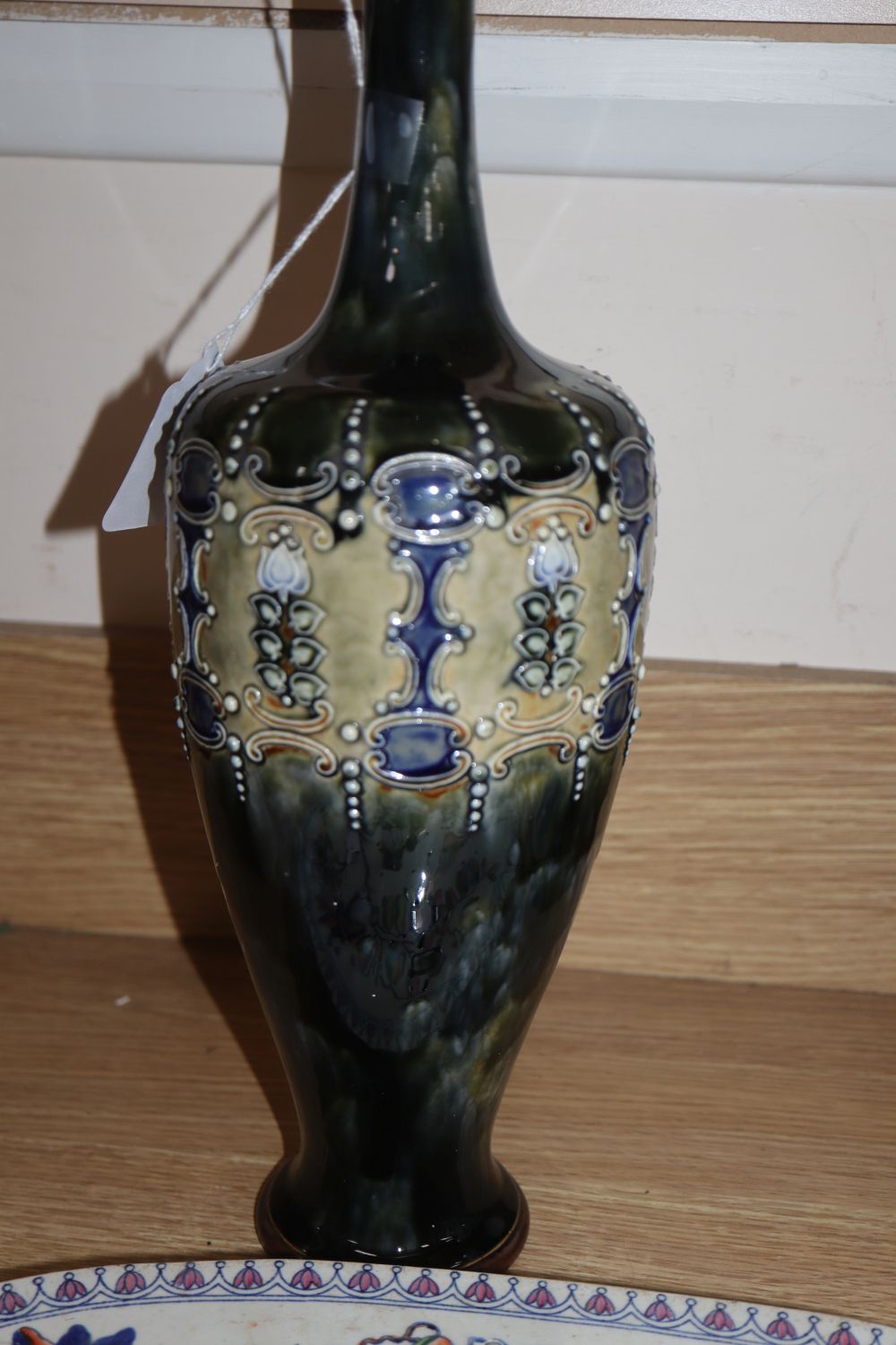 A Stone China strainer, a Staffordshire Highlander group, a Royal Doulton vase and a Wedgwood biscuit barrel (4)